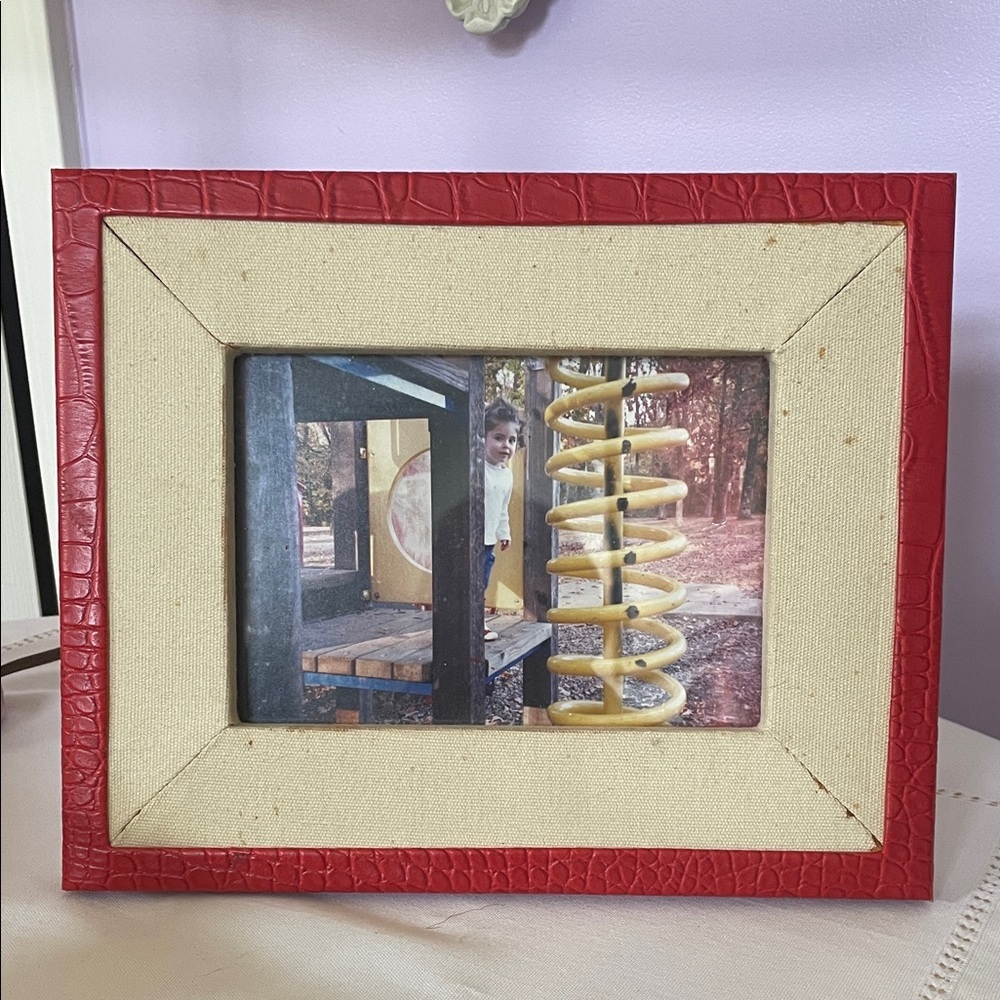 Red leather trim picture frame holds 5x7